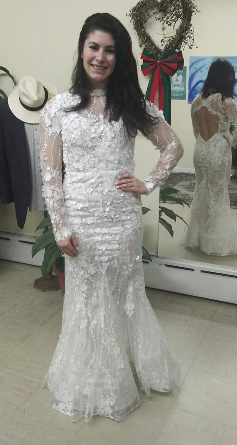 Bride in a lace gown after a fitting at Victor's